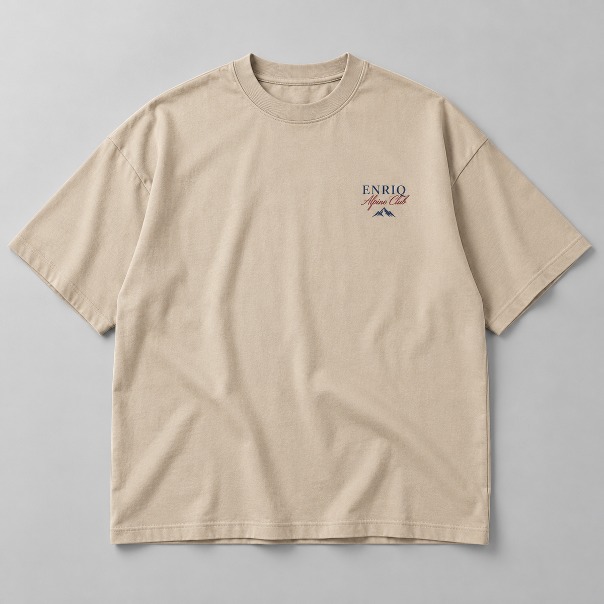 EnriQ Alpine Club Sand Oversized – flatlay voorkant
